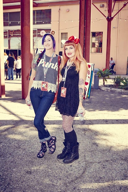 Two young ladies posing while wearing Hello Kitty-inspired accessories