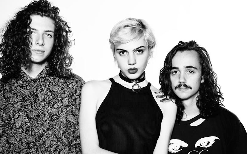 Sunflower Bean's band members posing for a black and white photo