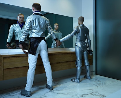 A man holding hands with the robot in front of the mirror on the ANTM Cycle 21, Episode 8