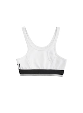 White sports bra with a black line from the Cara Delevingne's capsule collection