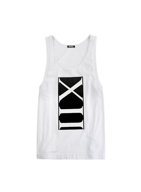 White sleeveless shirt with a black box containing roman 12 in it from the Cara Delevingne's DKNY ca...