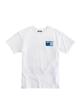 White t-shirt with a blue box containing text from the Cara Delevingne's DKNY capsule collection