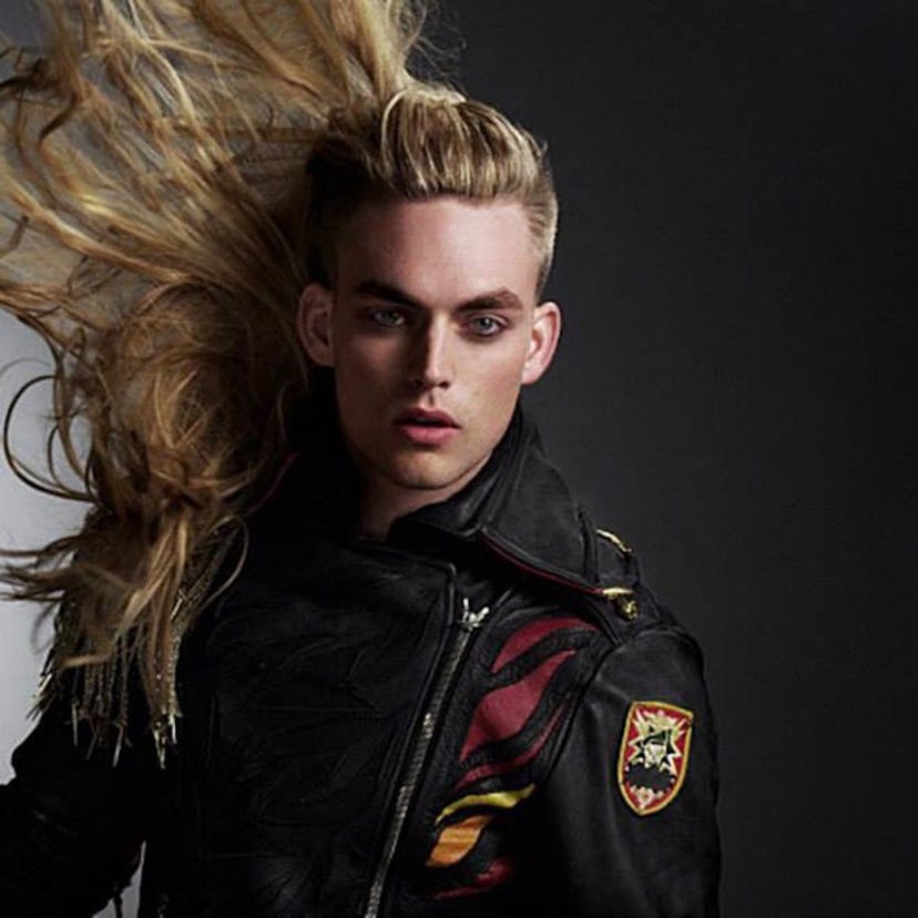 Will Jardell posing for a photoshoot for ANTM while doing a hair flip