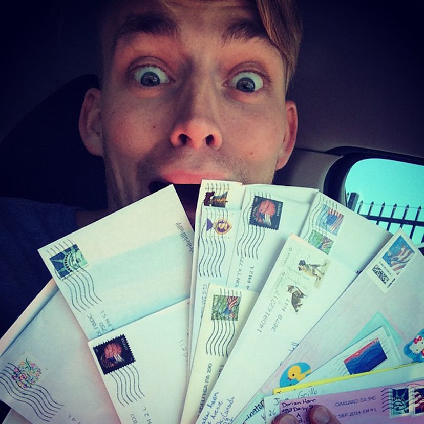 Will from ANTM holding multiple envelopes in front of him and doing a shocked face