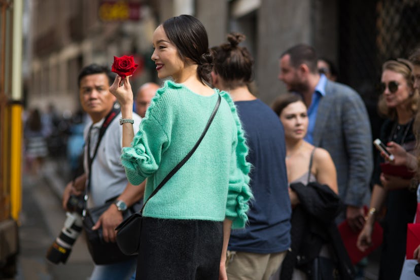 Fei Fei Sun showing off her beautiful red rose by photographer Michael Dumler