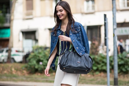 Mijo Mihaljcic smiling while rocking a denim jacket over her shoulders by photographer Michael Dumle...