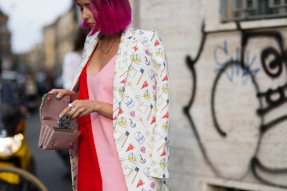 Girl with a short magenta bob wearing a loose red and pink dress and a long white blazer with a fun ...
