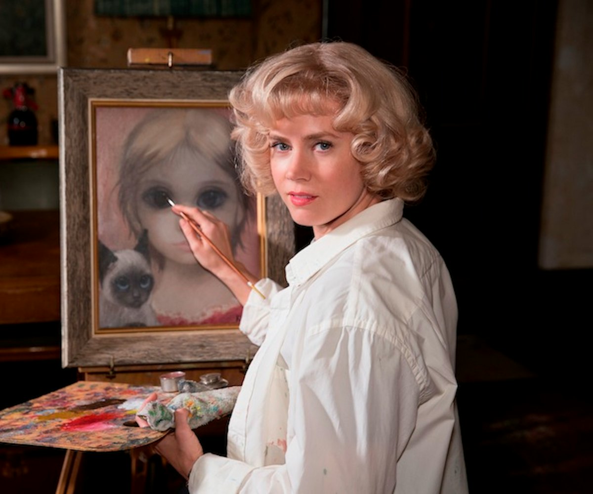 Margaret played by Amy Adams in Big Eyes, painting a girl with big eyes. 