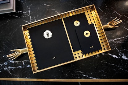 Sleek black and gold notebooks with initials on the front