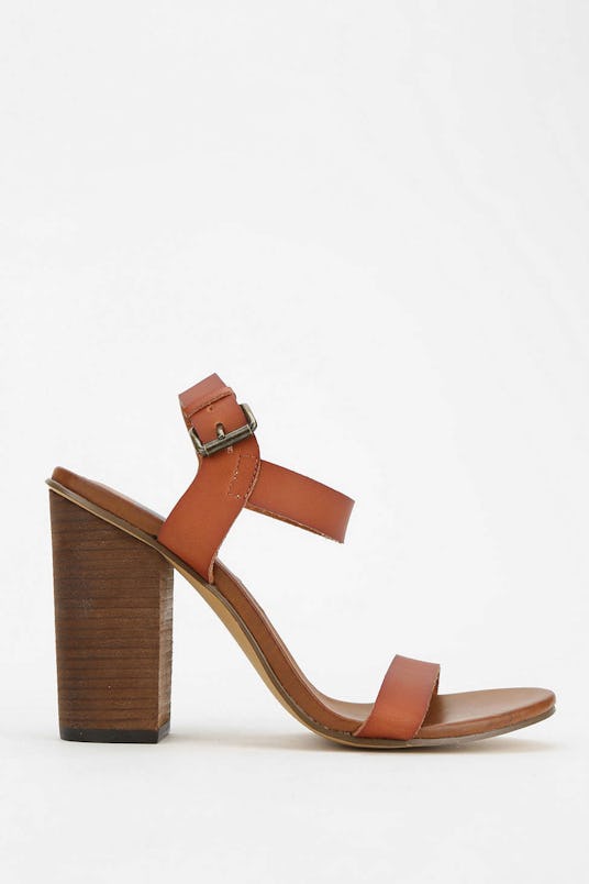 Brown sandals named We Who See Wylde Heeled Sandal from Urban Outfitters