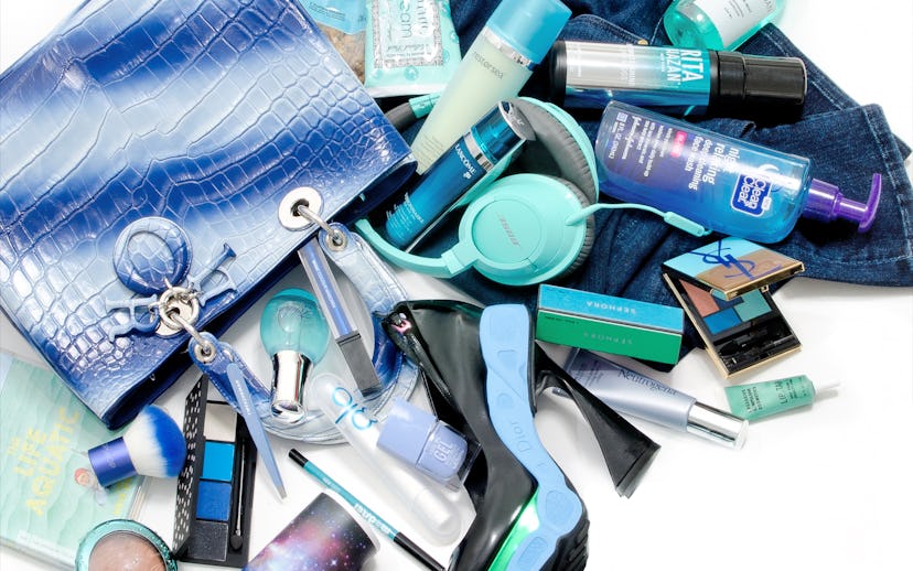 A blue Dior bag, jeans, blue headphones, and a lot of blue-colored beauty products and creams all th...