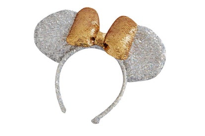 A shimmery silver Minnie Mouse headband with a golden shimmery bow from ASOS' new collaboration with...