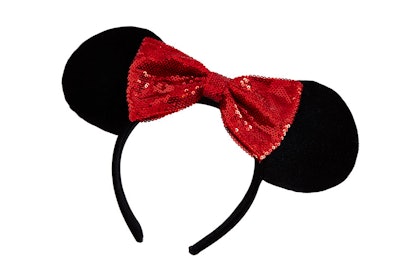 A black Minnie Mouse headband with a red shimmery bow from ASOS' new collaboration with Disney