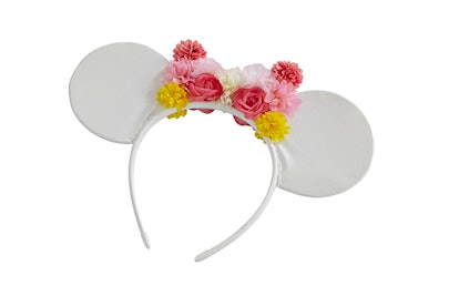 A white Minnie Mouse headband with a floral bow from ASOS' new collaboration with Disney