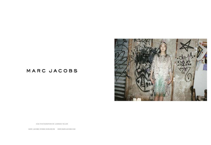 Xiao Wen Ju wearing a dress from the Spring/Summer 2012 Marc Jacobs collection in front of the wall ...
