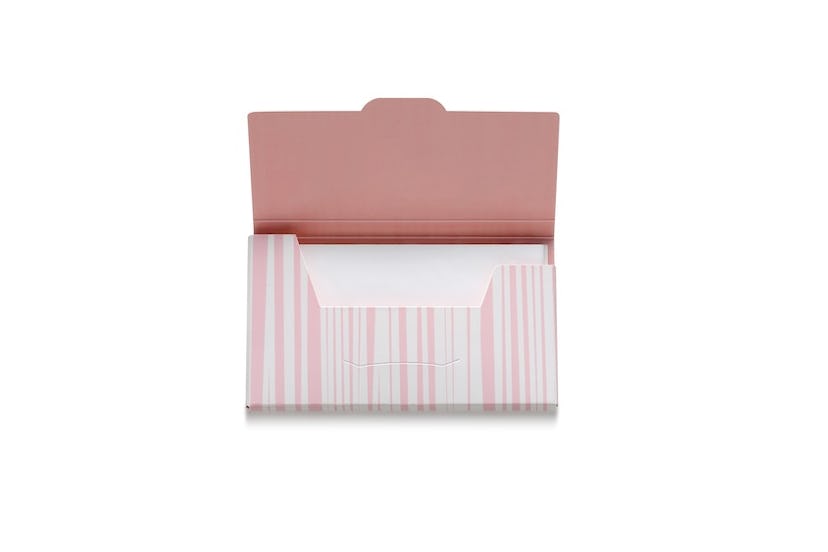 A pastel-pink and white packaging of the Shiseido Sweat & Oil blotting paper