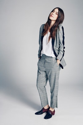 Danielle Haim in a grey suit 