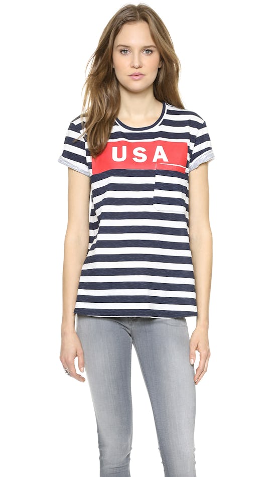 A model posing in a blue and white T-shirt with stripes and the USA label on the front side