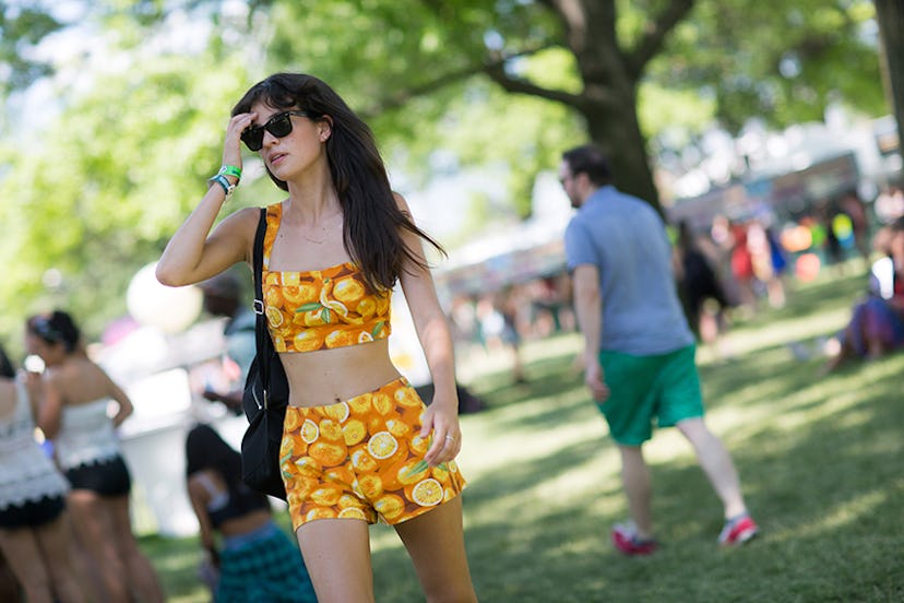 Amanda Murray in a crop top and shorts set with oranges on it at Governors Ball