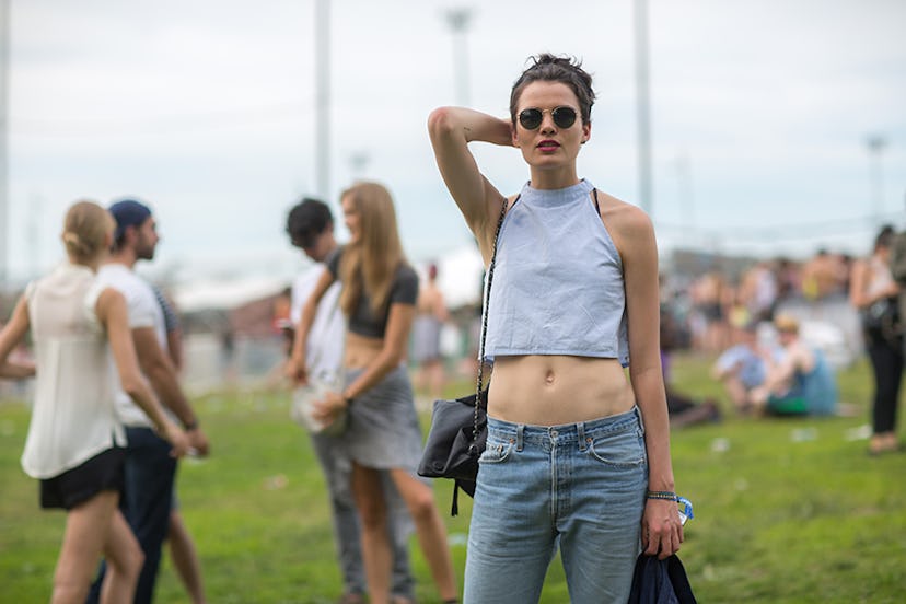 Anne Verhallen in a grey cropped tank and low-waist jeans at Governors Ball 