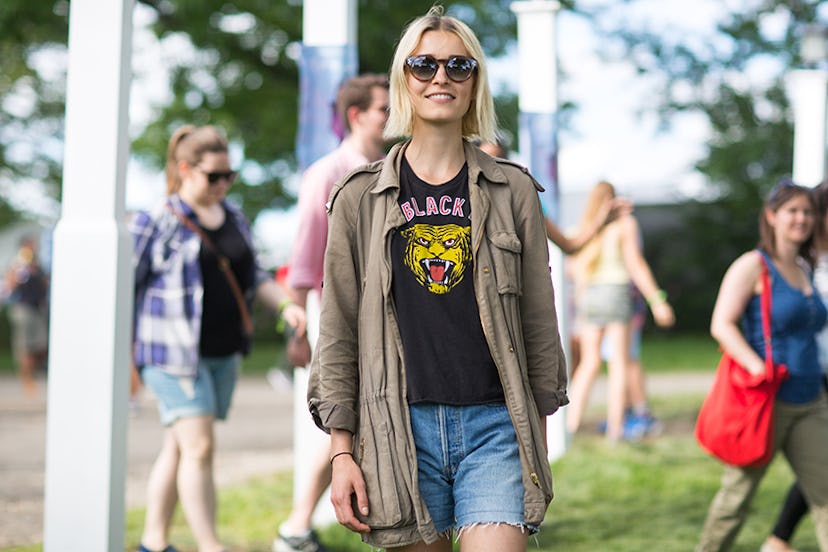 Jana Wirth in a black top, denim shorts and a button-up on top at Governors Ball
