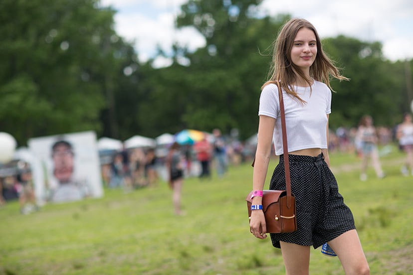 Tilda Lindstam in a white t-shirt and black skirt at Governors Ball 