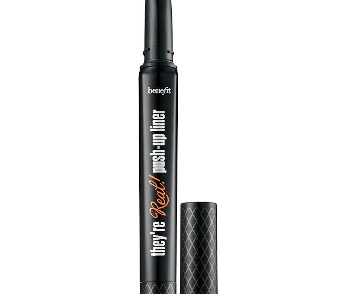 A black tube of the black Benefit push-up liner next to it's lid