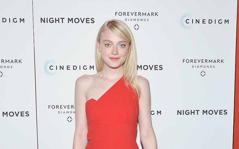 Dakota Fanning in the bright red structured one-shoulder Roland Mouret jumpsuit at the premiere of h...