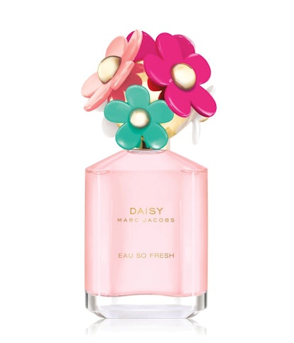 Perfume called "Daisy" by Marc Jacobs, in a peachy bottle with colorful flowers on top