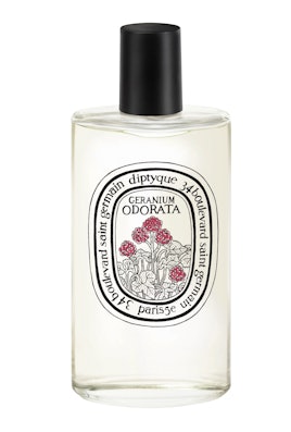 A bottle of perfume called "Diptyque Geranium Odorata" that smells like a forest. 