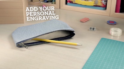 Ray-Ban case with a pencil inside lying on a table with text above it "Add your personal engraving"