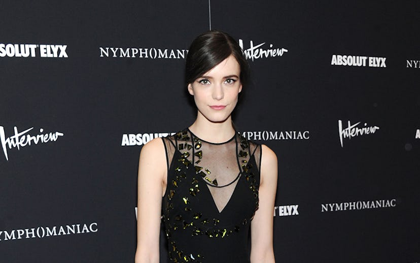Stacy Martin wearing a floor length Prada black tulle and silk frock for the Nymphomaniac premiere i...