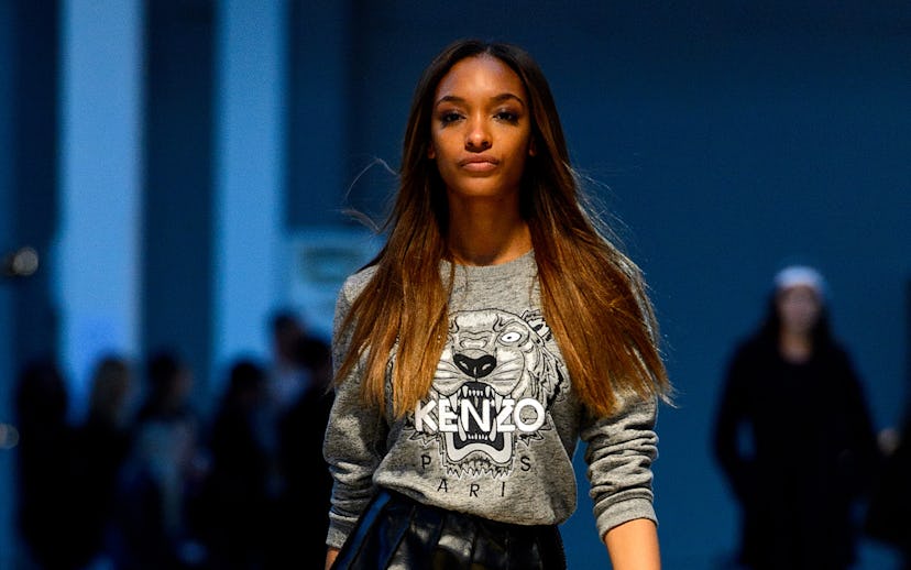 Jourdan Dunn in a Kenzo Sweater and a black leather midi skirt