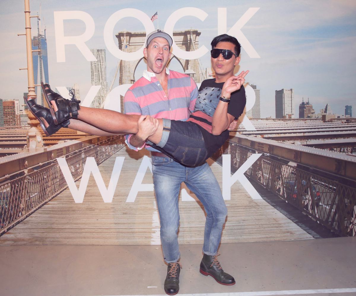 Johnny Wujek holding the Swedish blogger Bryanboy 