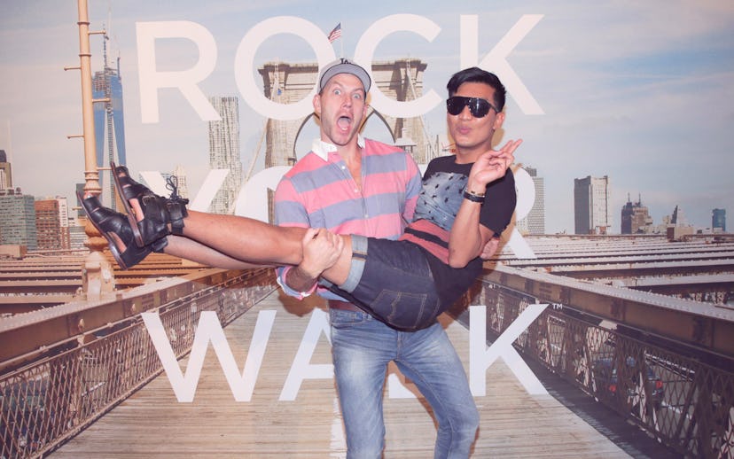 Johnny Wujek holding the Swedish blogger Bryanboy 