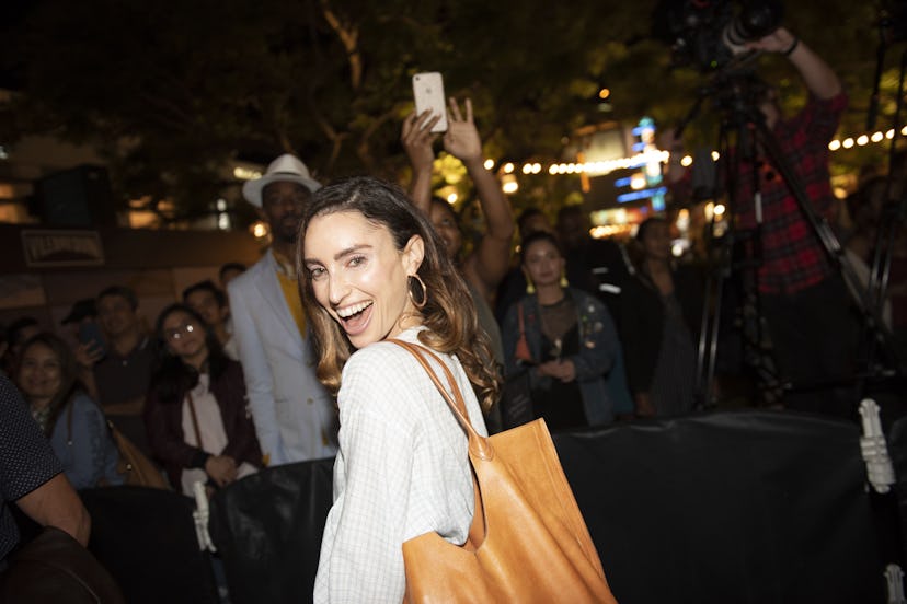 A happy woman dancing at Zolita's performance