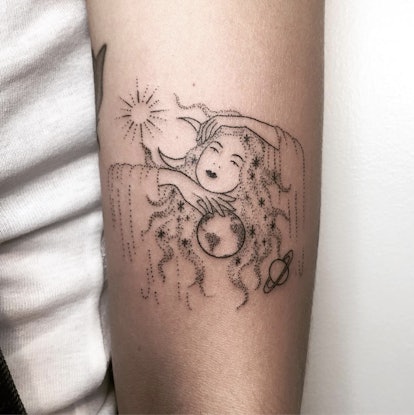 Mystical female with astronomical elements tattoo by Tati Compton.