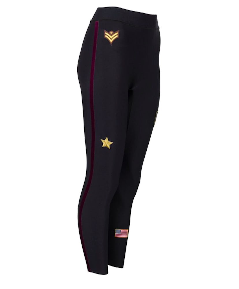 Black Ultracor leggings with a burgundy stripe down the leg and emblems in the shape of a star and t...