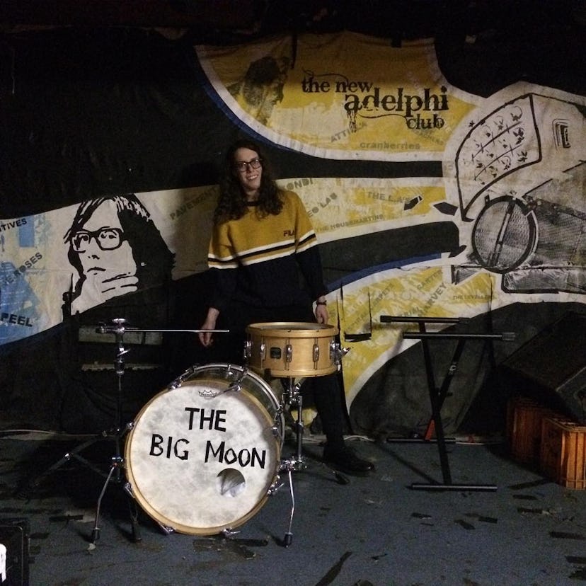 Fern Ford posing for a photo with her drums