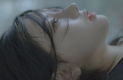 A closeup of Aseul's face as she is lying down and looking up