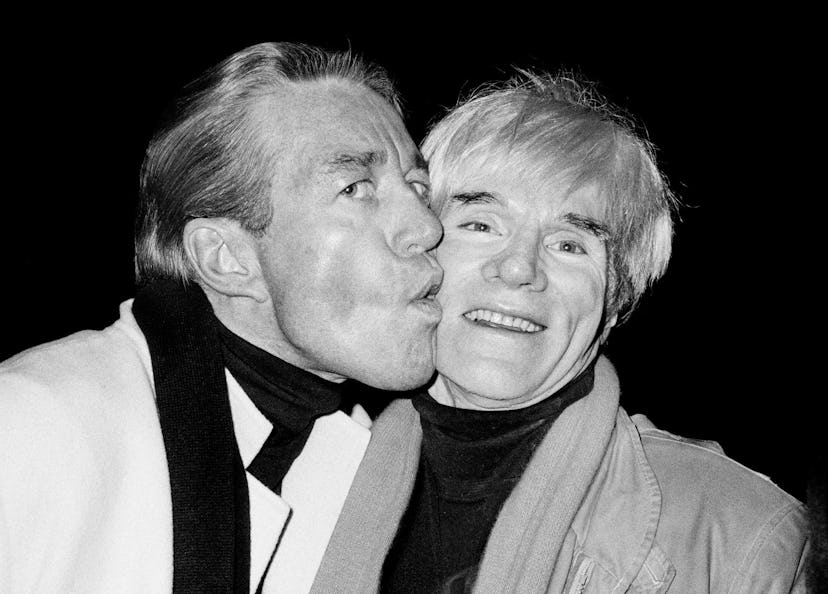Halston kisses Andy Warhol's cheek