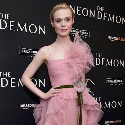 Elle Fannning on the red carpet in a pink evening dress