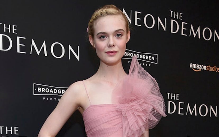 Elle Fannning on the red carpet in a pink evening dress