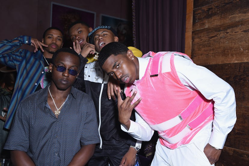 Christian Combs and other guests posing for the camera at Lauren Jauregui's party
