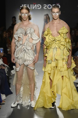 Two models at the Flying Solo runway show in white and yellow ruffled outfits by Subin Hahn