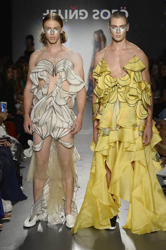 Two models at the Flying Solo runway show in white and yellow ruffled outfits by Subin Hahn