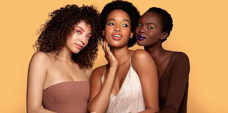 Three girls with different skin tones having new makeup by Covergirl on their faces