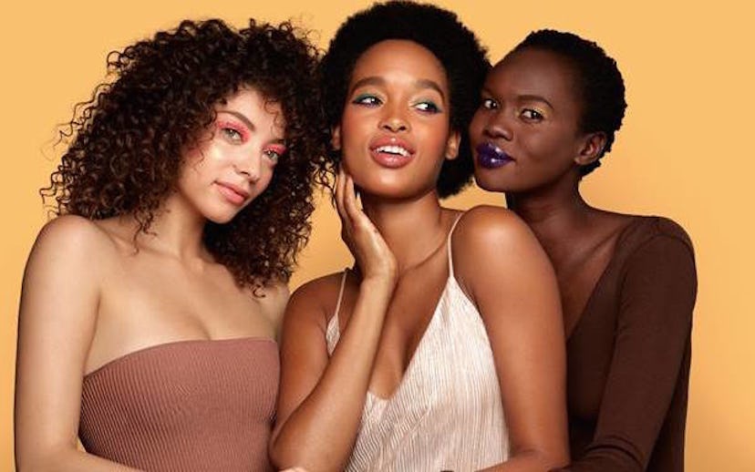 Three girls with different skin tones having new makeup by Covergirl on their faces