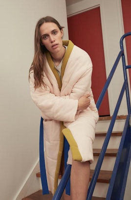 Offhours' Homecoat robe that is combined with a comforter, in white with yellow down the middle 