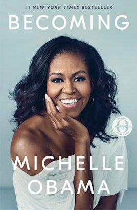 The cover of "Becoming" by Michelle Obama featuring Michelle posing with her hand on her chin 